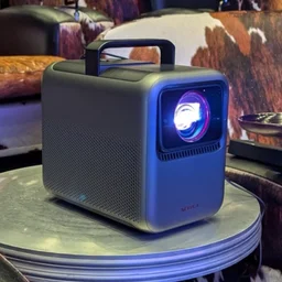 The Anker Nebula X1 projector pictured on a coffee table